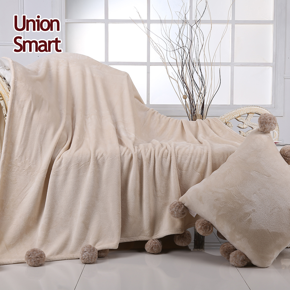 Quality assurance sofa flannel polyester blanket with pompoms decorative coral fleece blanket mantas